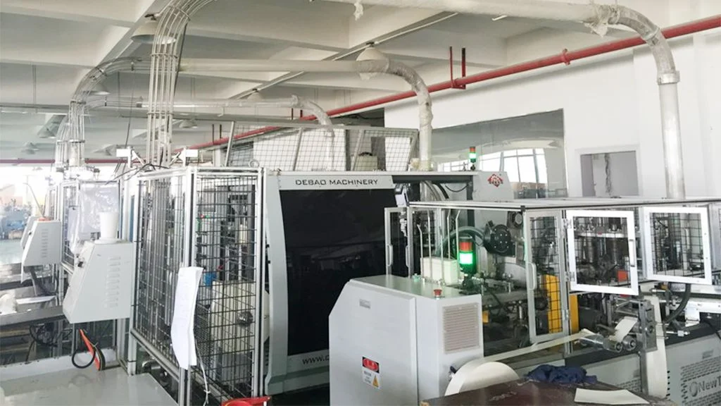 Paper cup forming machines on a factory production line